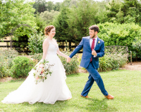 Bride and Groom Walking in a meadow