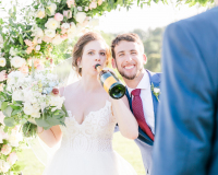 Bride and Groom with Veuve Clicquot Bottle