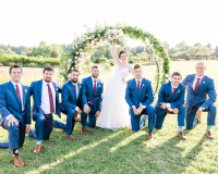 Bride with groomsmen at the altar.