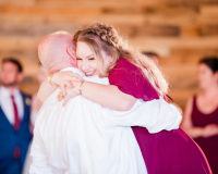 Dad hugging his daughter