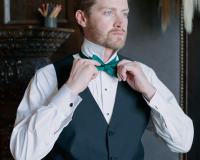 Groom with emerald green bowtie
