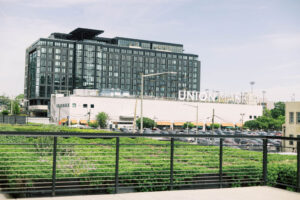 Rooftop greenery and skyline views at Autoshop, an outdoor event space for weddings, welcome parties, and bar and bat mitzvahs