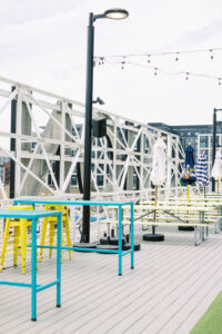 Modern rooftop lounge setup at Union Market with colorful chairs and string lights, perfect for casual wedding or mitzvah events
