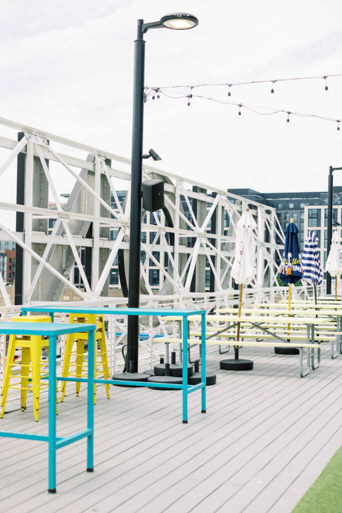 Modern rooftop lounge setup at Union Market with colorful chairs and string lights, perfect for casual wedding or mitzvah events