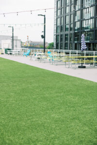 Modern rooftop lounge setup at Union Market with colorful chairs and string lights, perfect for casual wedding or mitzvah events