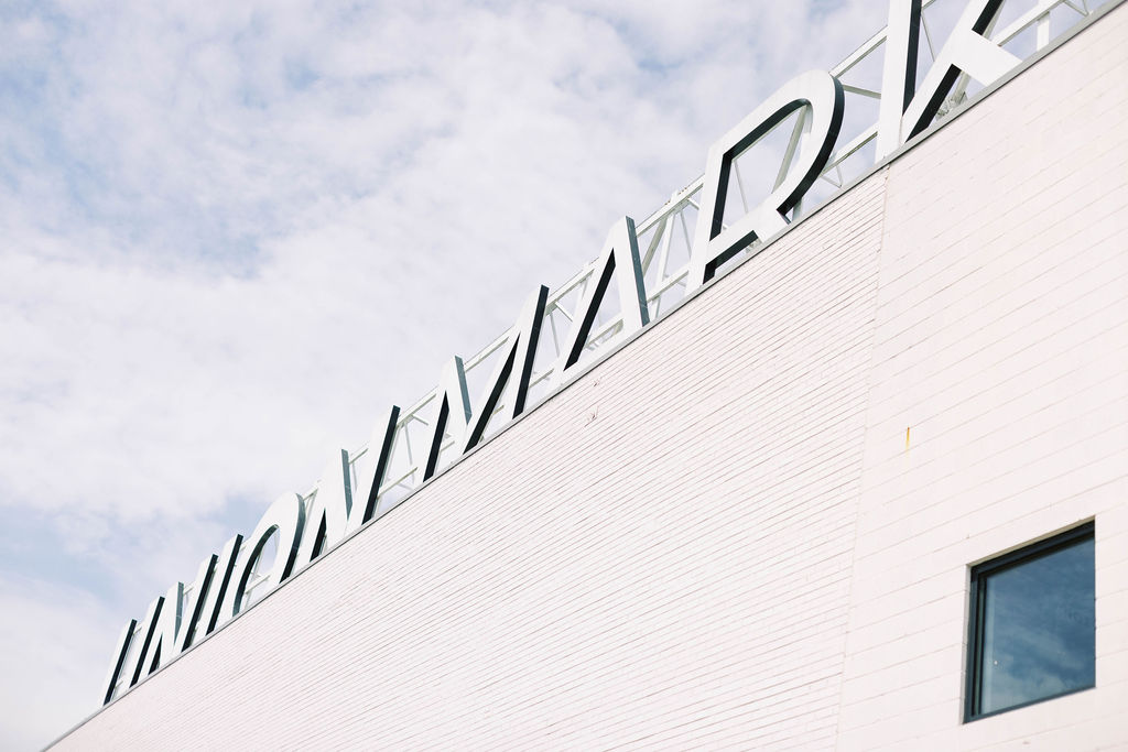 Iconic rooftop signage at Union Market in Washington, D.C A modern venue for weddings, bar mitzvahs, and stylish city celebrations