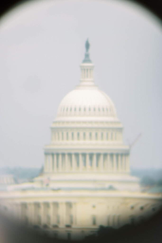 View of the U.S. Capitol from Spy Museum rooftop binoculars, a unique feature of this modern D.C. wedding and mitzvah venue
