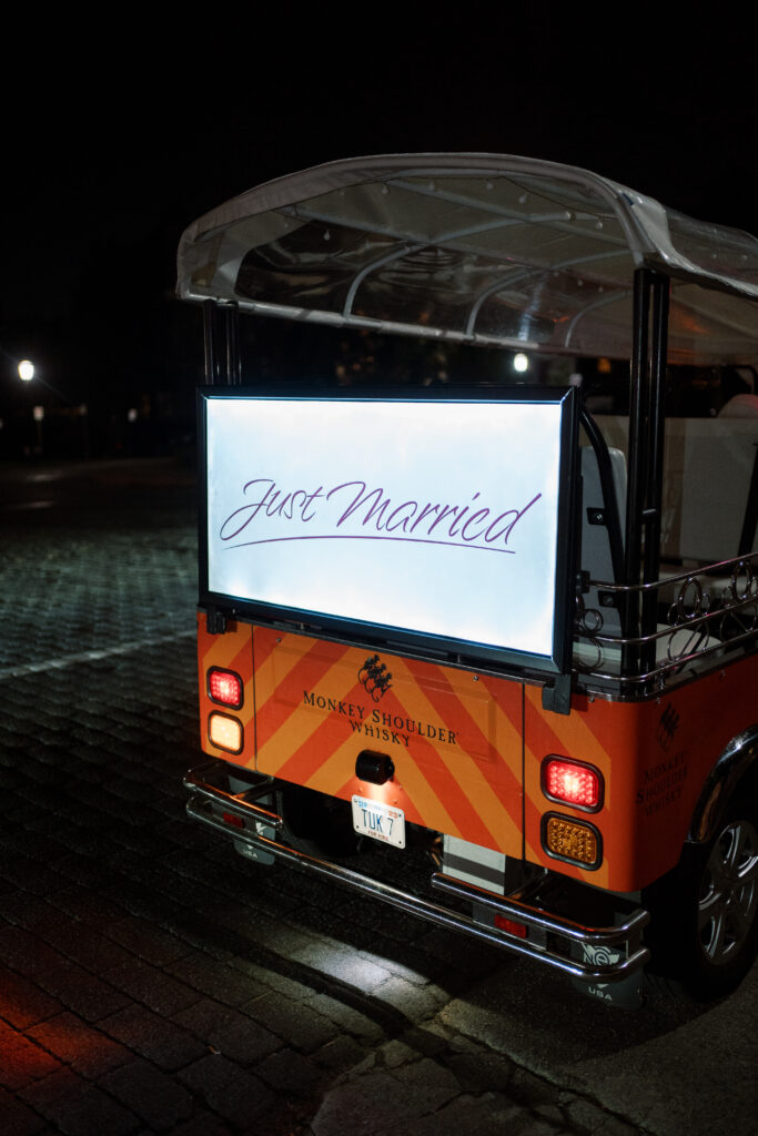 RVA Tuk Tuk getaway after wedding at The Branch Museum, complete with 'Just Married' sign. Richmond Wedding Planner.
