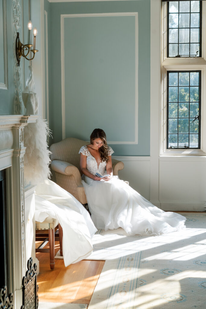 Quiet moment of the bride reading a wedding day letter inside The Branch Museum. Richmond Virginia Wedding Planner.
