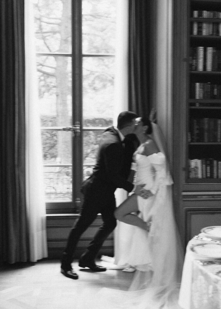 Bride and groom kissing in Meridian House library, Washington DC wedding portrait with modern editorial style