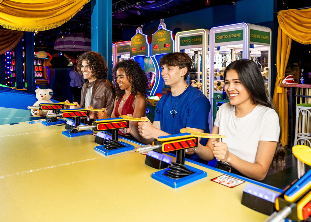 Teen guests playing arcade games at a Bar or Bat Mitzvah during mitzvah celebration at a Bar or Bat Mitzvah at Swingers Carnival Washington DC