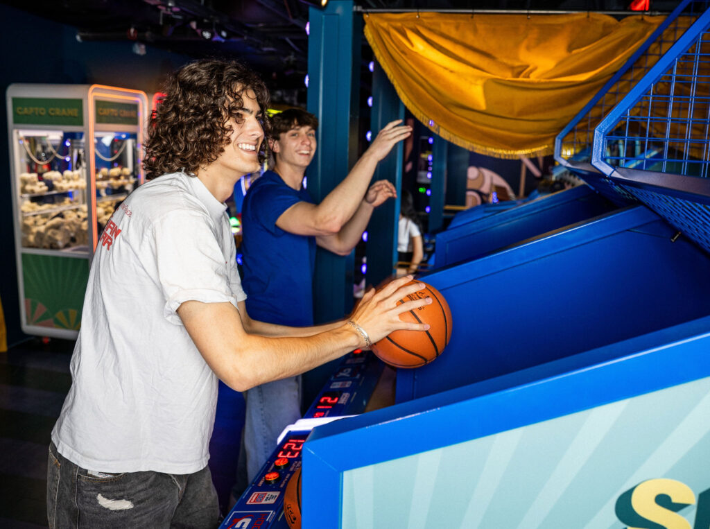 Teen guests playing arcade games at a Bar or Bat Mitzvah during mitzvah celebration at a Bar or Bat Mitzvah at Swingers Carnival Washington DC