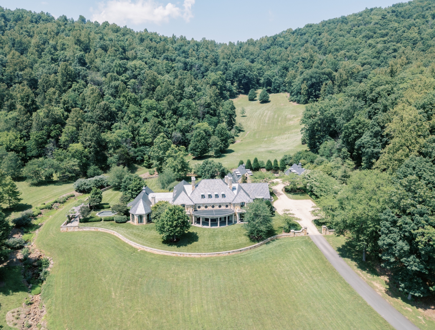 A distant view of Bramblewood Estate, a French-Inspired mansion on 500 acres in Charlottesville.