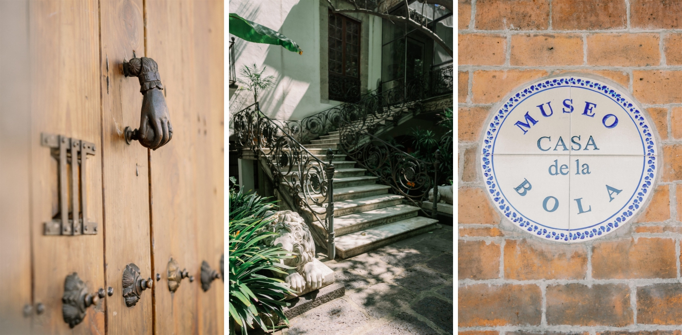 A staircase with intricate iron railings in a lush garden at Casa de la Bola